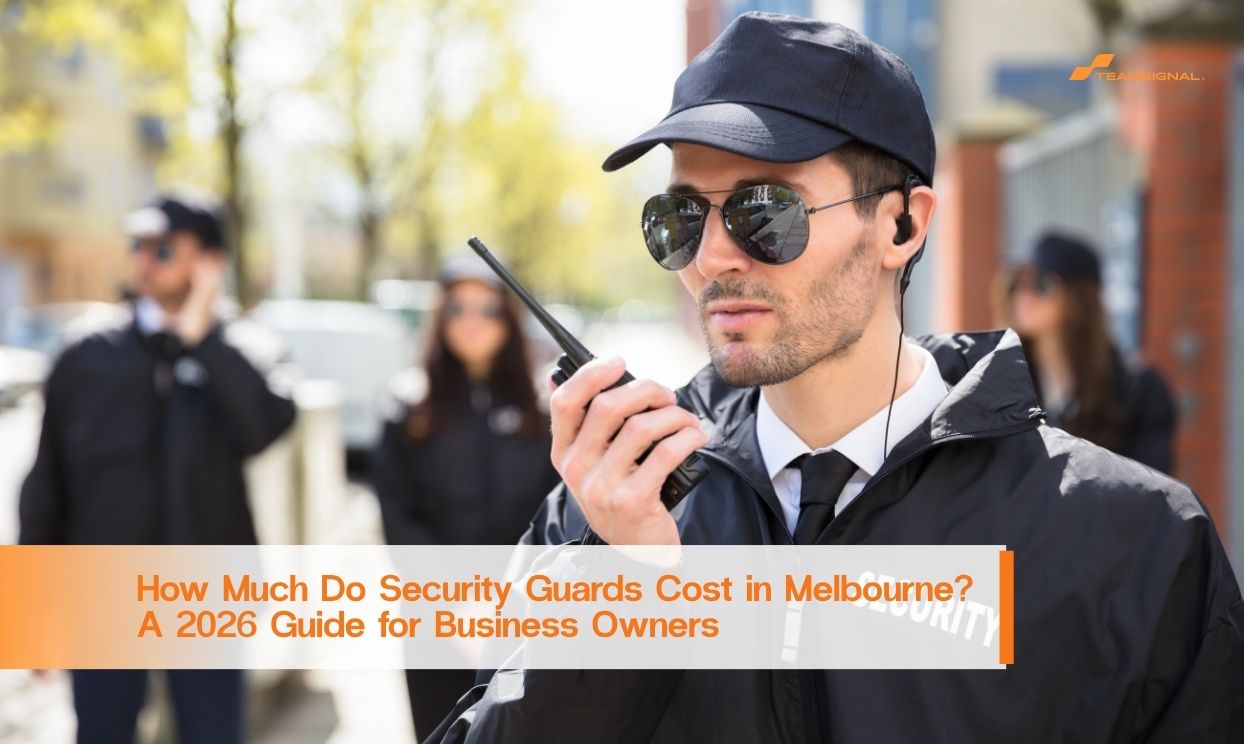 Security guard using a two-way radio in Melbourne, promoting a 2026 guide to security guard costs for business owners.