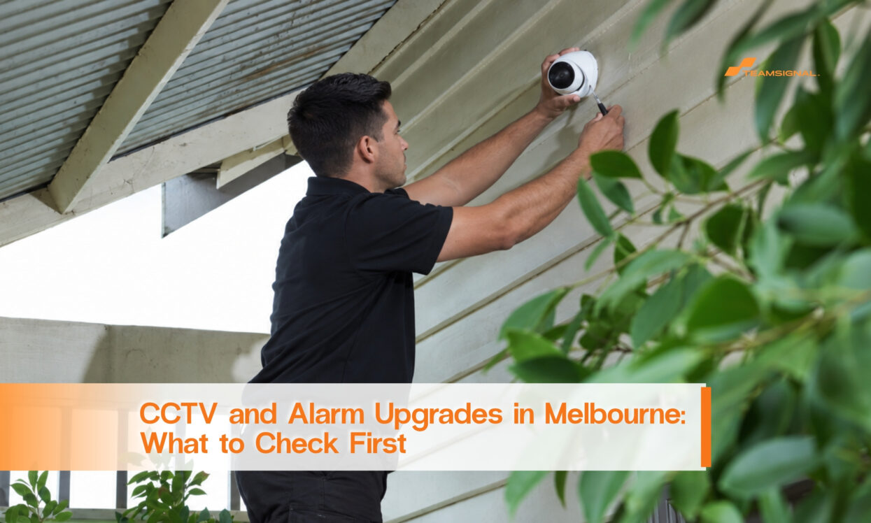 Security technician installing an outdoor CCTV camera at a Melbourne property